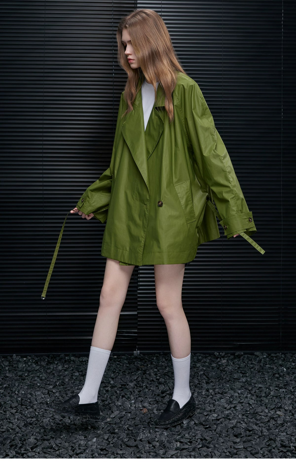 Moss Green oversized cotton trench jacket worn open with lapels and a trailing belt