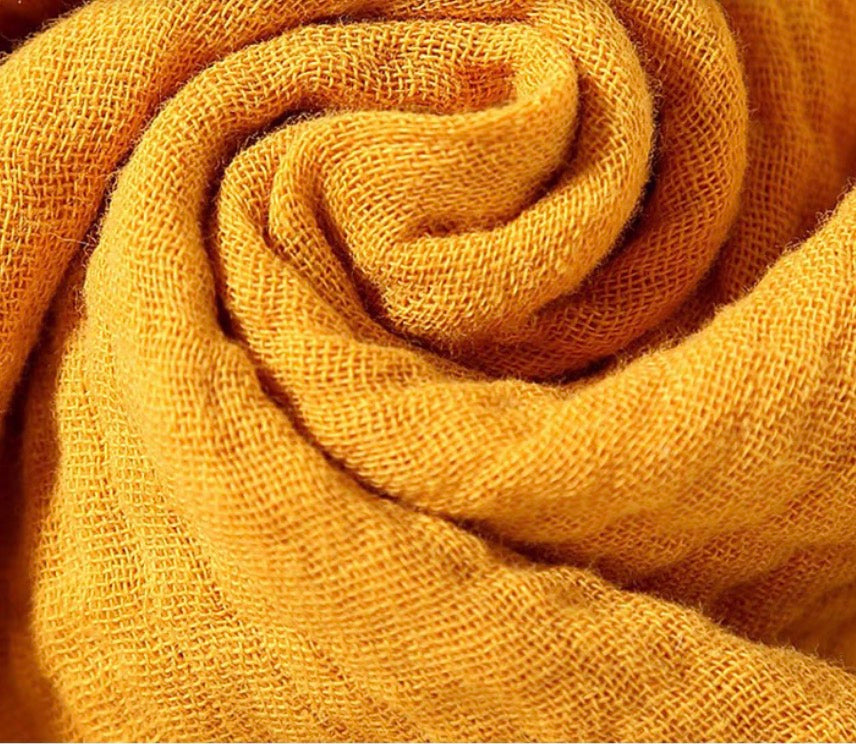 Yellow cotton gauze texture detail of baby comfort cloth toy