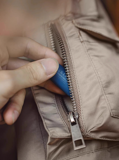 Detail shot of arm zip pocket with metal zipper on N-3B parka sleeve.