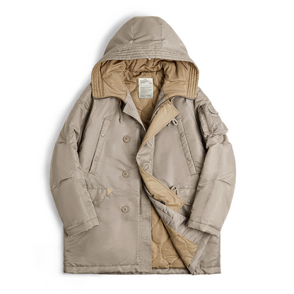 Flatlay of khaki N-3B snorkel parka showing double placket and quilted lining.