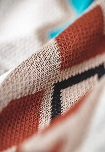 Navajo-Inspired Geometric Knit Beach Shorts diamond pattern macro close-up showing yarn texture and geometric knit pattern