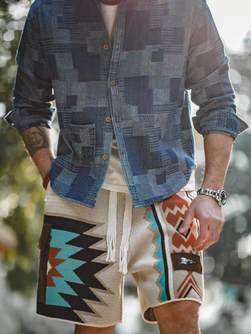 Navajo-Inspired Geometric Knit Beach Shorts diamond pattern worn with blue shirt showing relaxed fit and geometric knit panels