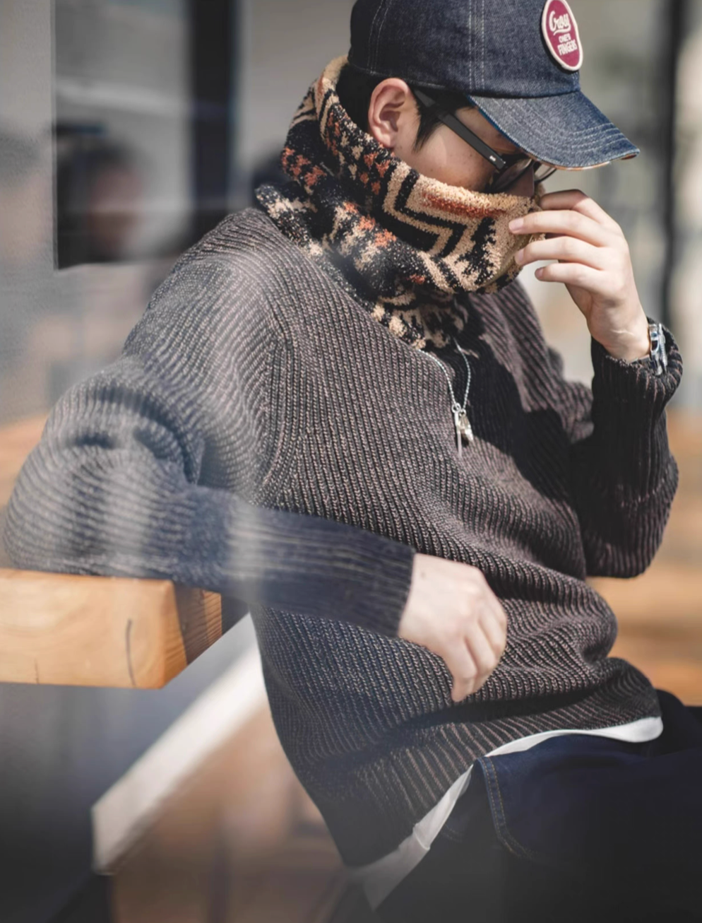 Model wearing Mocha Navajo-Inspired Half-Sherpa Neck Warmer providing full neck coverage in outdoor casual styling