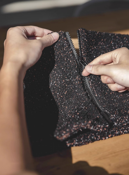 Close-up of Starry Black neck warmer zipper showing durable closure and textured fleece fabric