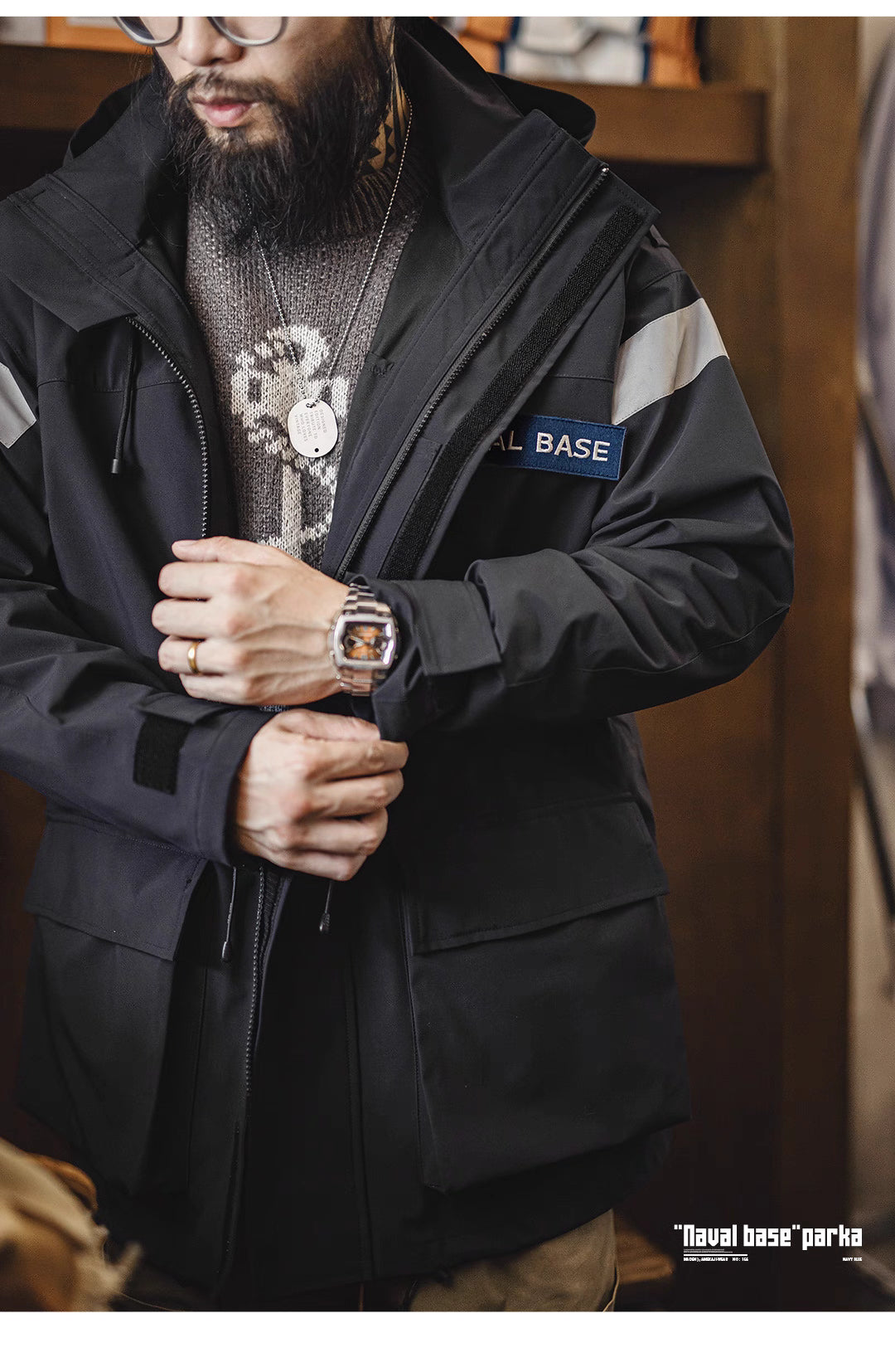 Close-up of parka’s front zipper and cuff design highlighting windproof construction