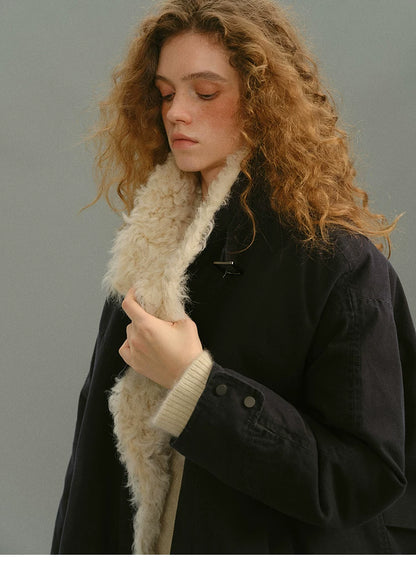 Navy cotton down parka with cream curly shearling collar and snap cuffs