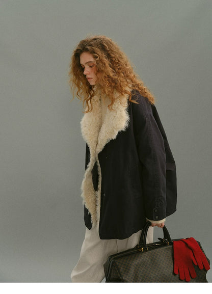 Side view of a Navy shearling-trimmed parka showing dropped shoulders and hip length