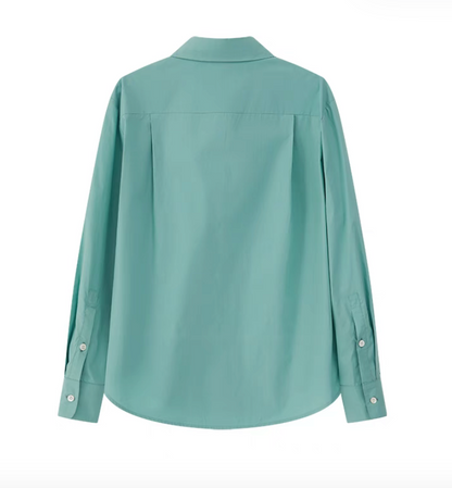 Green embroidered relaxed shirt back view in flat lay highlighting clean structure and dropped shoulders