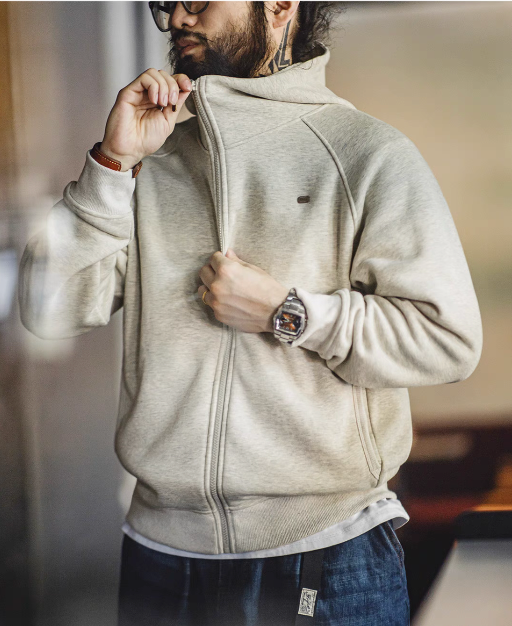 Snowflake white zip hoodie front view worn with high collar zip-up styling showing soft double knit fabric and relaxed fit
