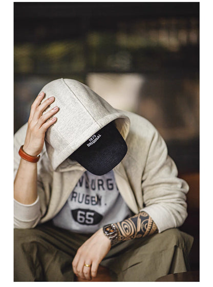 Snowflake white hoodie hood detail with cap styling showing soft fabric texture and casual streetwear look