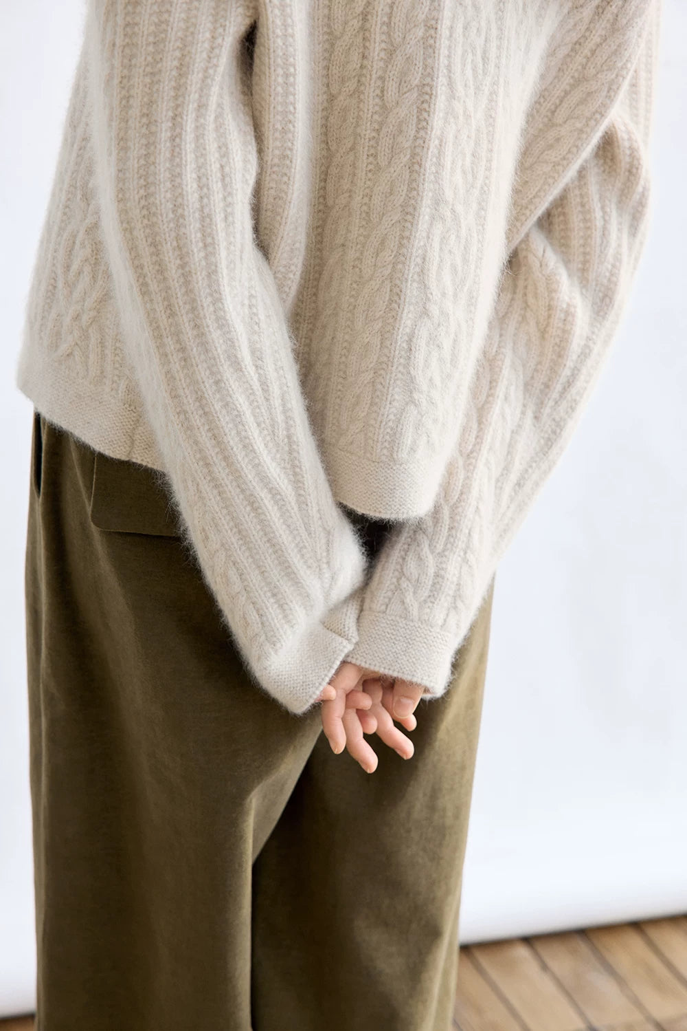 Oatmeal wool cardigan, close-up of ribbed cuff and sleeve detail