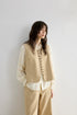 Three-quarter front view of Oatmeal cotton-linen corduroy vest and wide-leg pants set