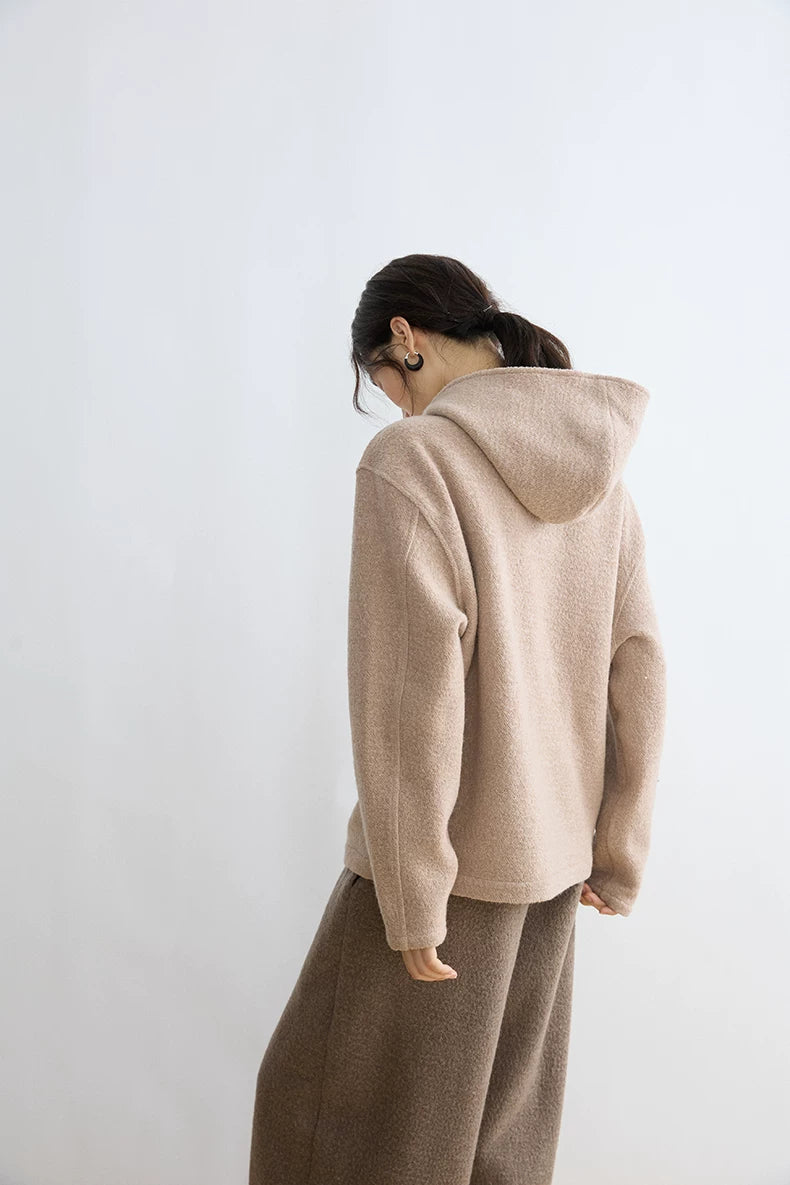 Back view of Oatmeal textured hoodie showing the hood, dropped shoulders and straight hem