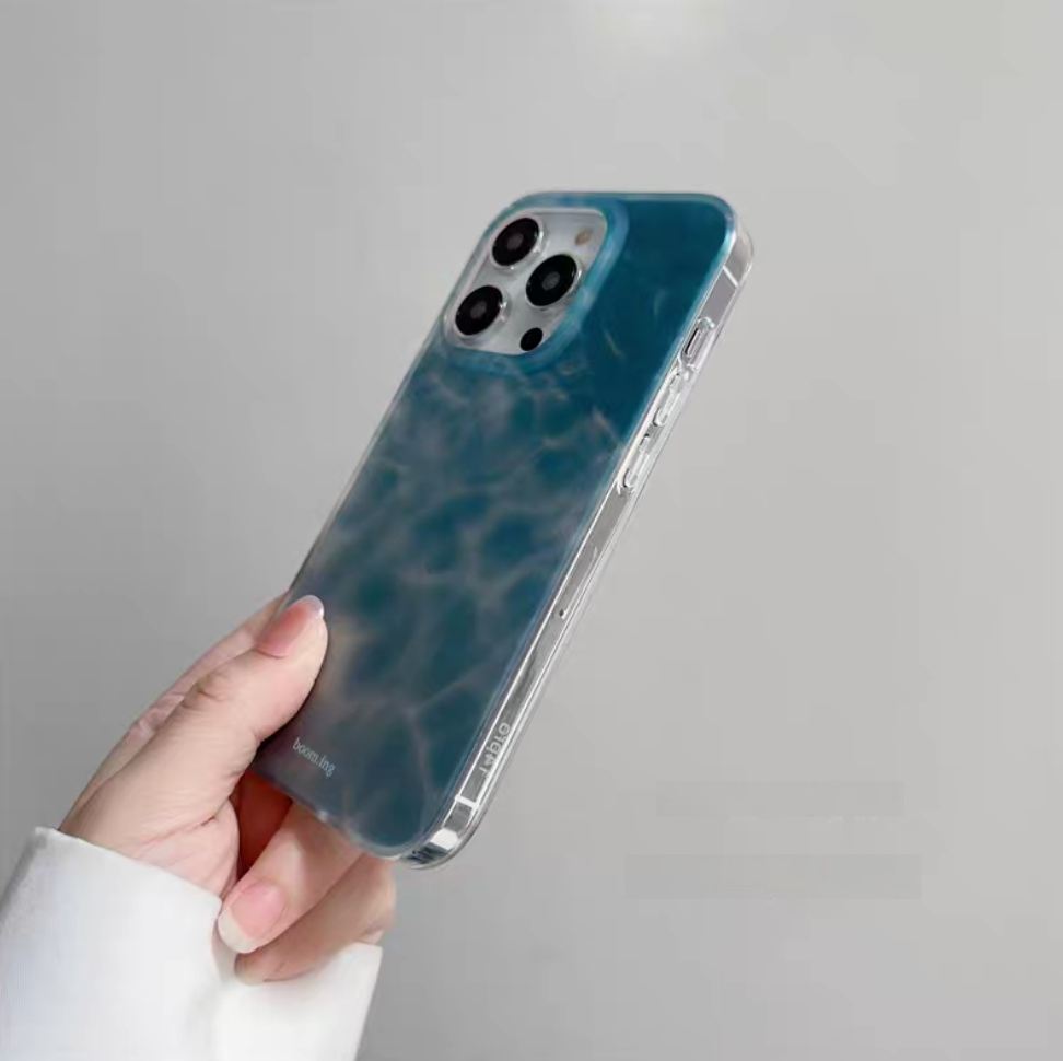 Ocean blue ripple phone case side detail view showing buttons and transparent frame design