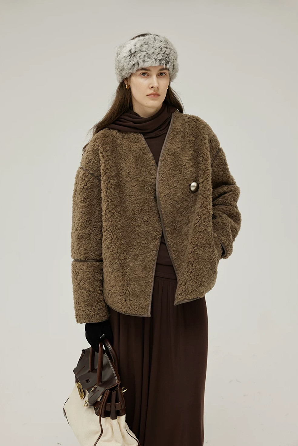 Front view of an Olive Brown V-neck teddy jacket closed with one oversized silver-tone button