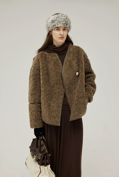 Front view of an Olive Brown V-neck teddy jacket closed with one oversized silver-tone button