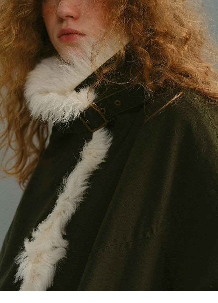 Close-up of an Olive cotton parka’s shearling collar with buckled throat strap