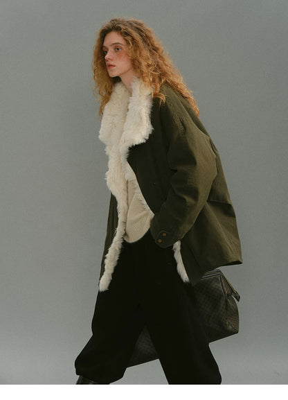 Olive shearling-trimmed down parka in motion, worn open with wide lapels