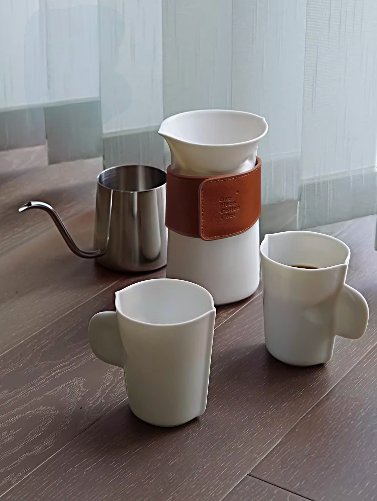 Milk White pour over coffee set placed on wooden table with cups and filter cup ready for brewing