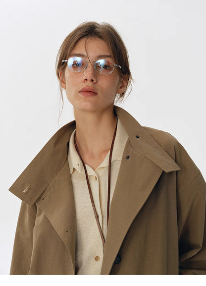 Portrait shot highlighting collar and fabric texture of trench jacket