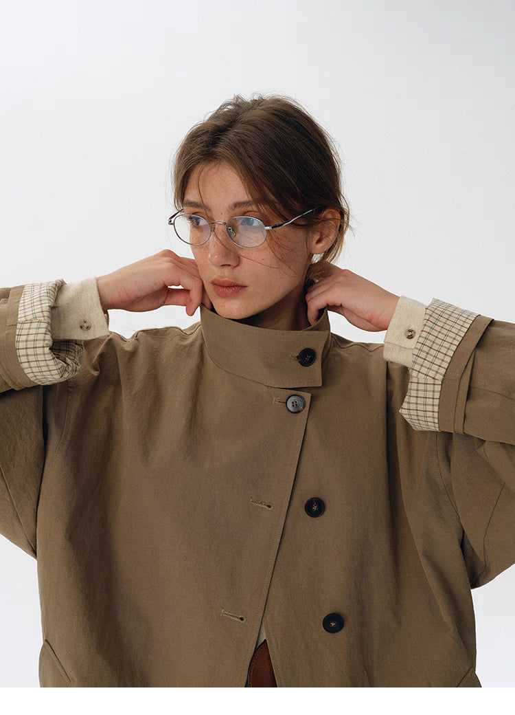 High-neck convertible collar styling on palm khaki trench jacket
