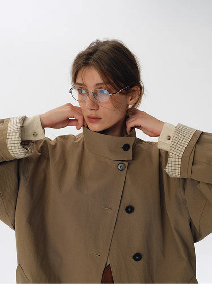 High-neck convertible collar styling on palm khaki trench jacket