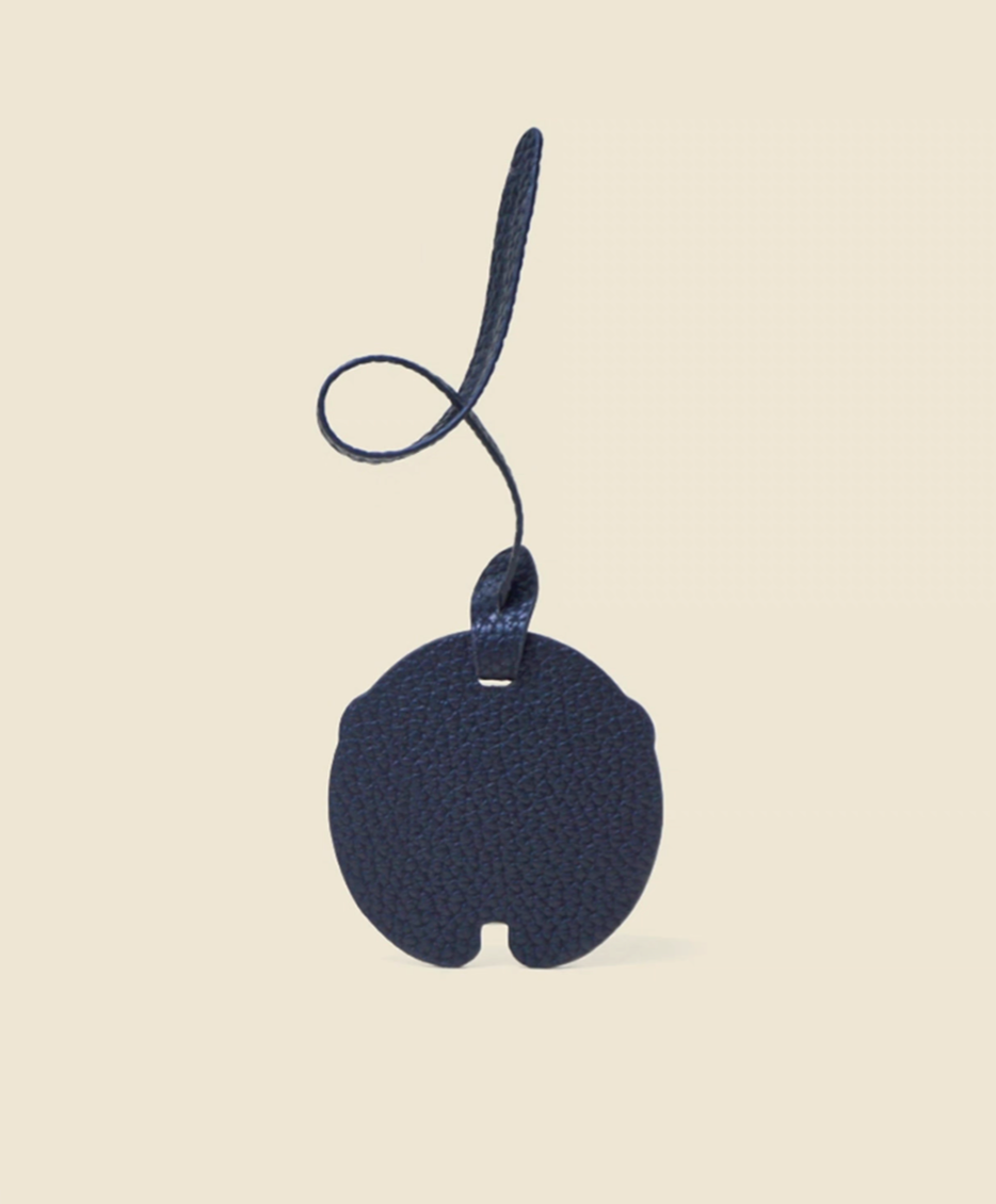 Panda charm keychain back view with smooth black microfiber leather and rounded shape