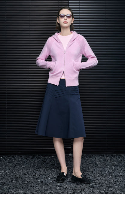 Full-length look of Pastel Pink wool-blend zip hoodie with navy pleated midi skirt and black loafers