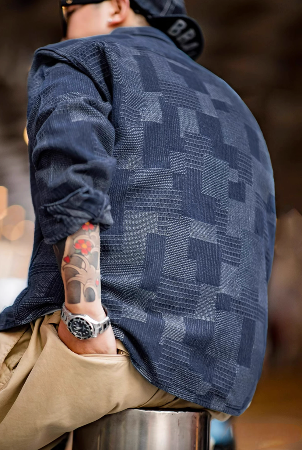 Back view of Denim Blue patchwork indigo shirt highlighting textured fabric, unique pattern, and relaxed silhouette