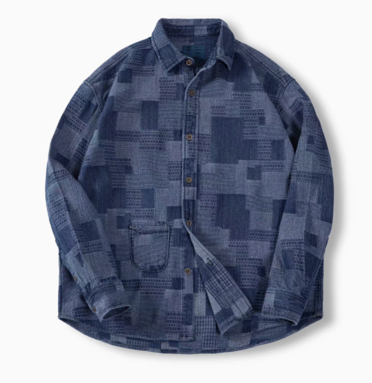 Denim Blue patchwork indigo denim shirt flat lay front view featuring Boro-inspired texture, button front closure, and chest pocket detail