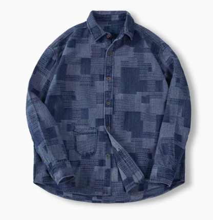 Denim Blue patchwork indigo denim shirt flat lay front view featuring Boro-inspired texture, button front closure, and chest pocket detail