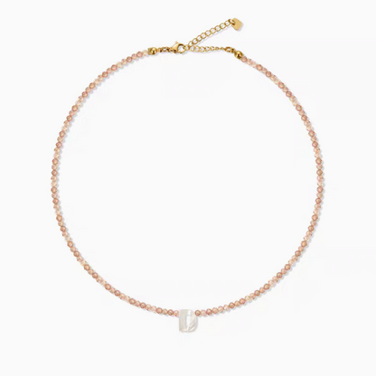 Personalized shell initial necklace with letter D charm on natural stone beaded chain clean product view