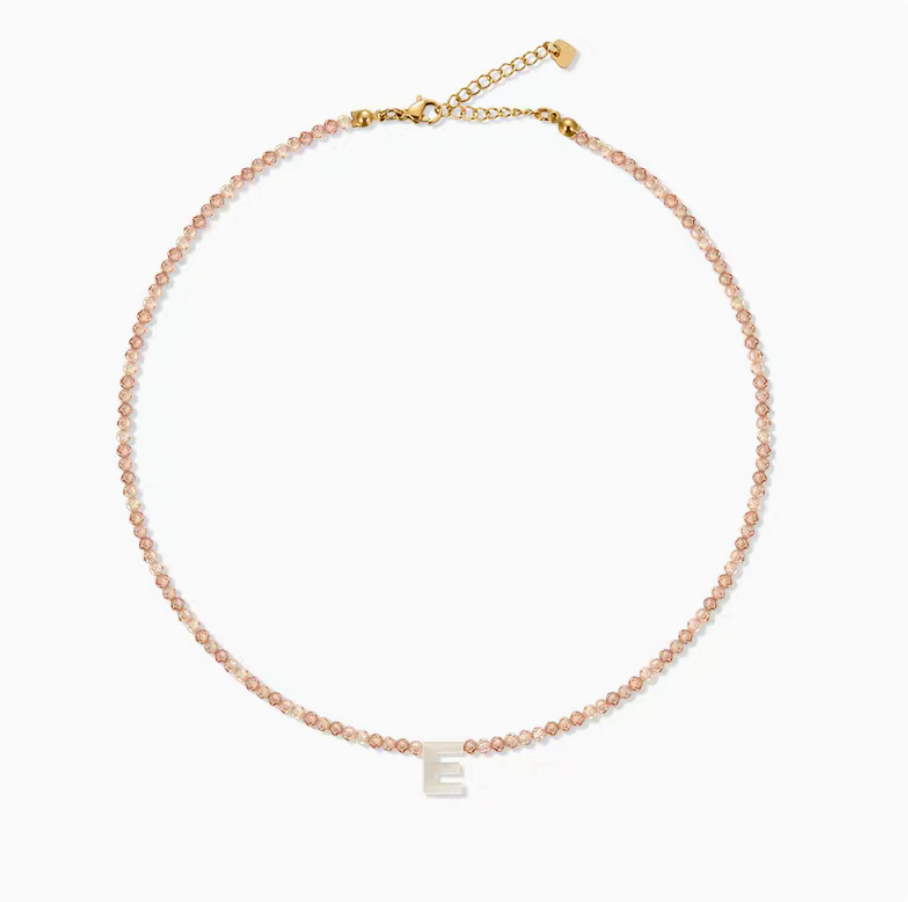 Natural color personalized shell initial necklace with letter E charm on delicate beaded chain product view