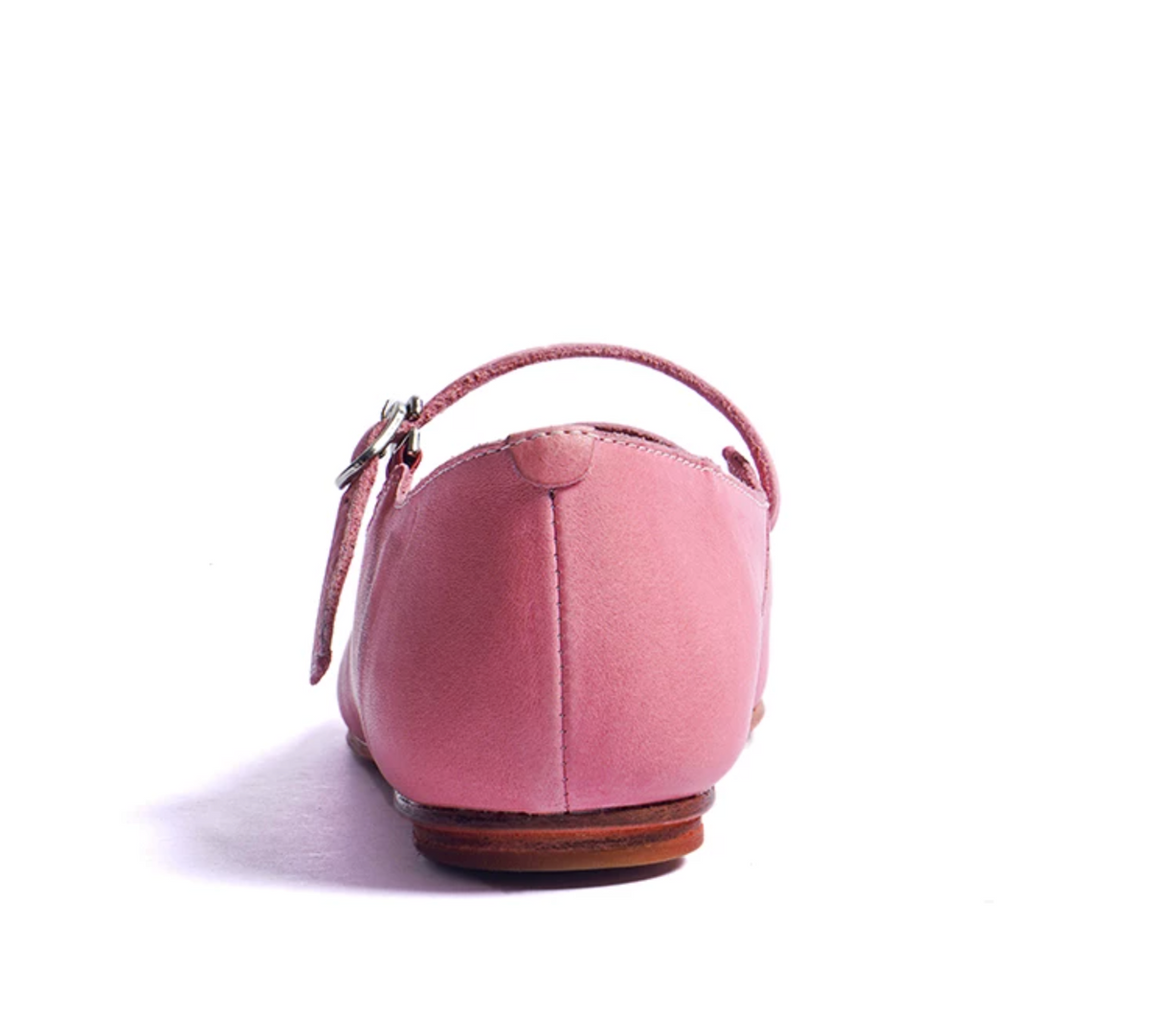 Back view of a Pink ballet flat showing the heel seam and adjustable buckle strap