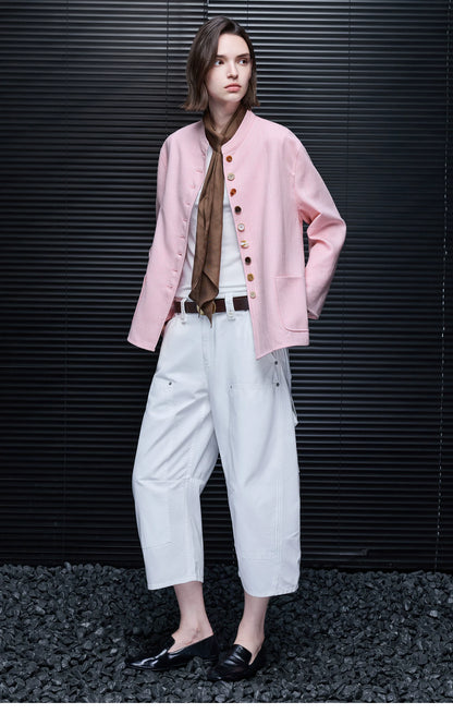 Full-length view of a Pink linen-blend jacket worn open with band collar and multicolor buttons
