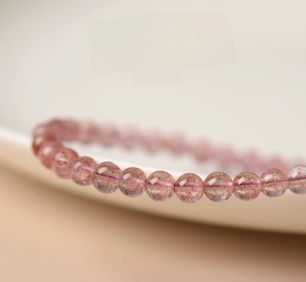 Macro close-up of pink strawberry quartz beads highlighting natural stone texture and clarity