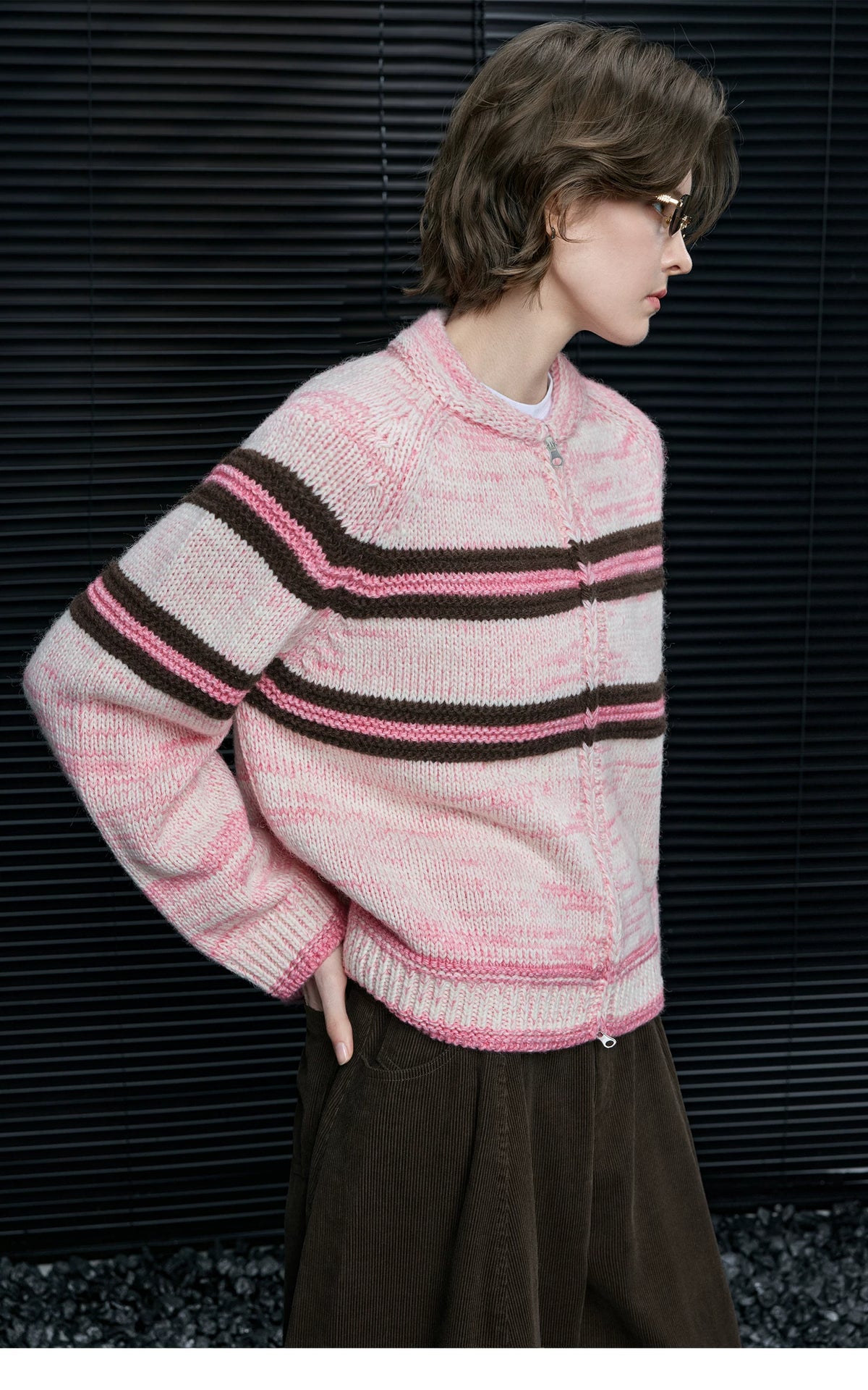 Side profile of Pink Stripe zip cardigan showing raglan sleeves, braided zip placket and ribbed hem
