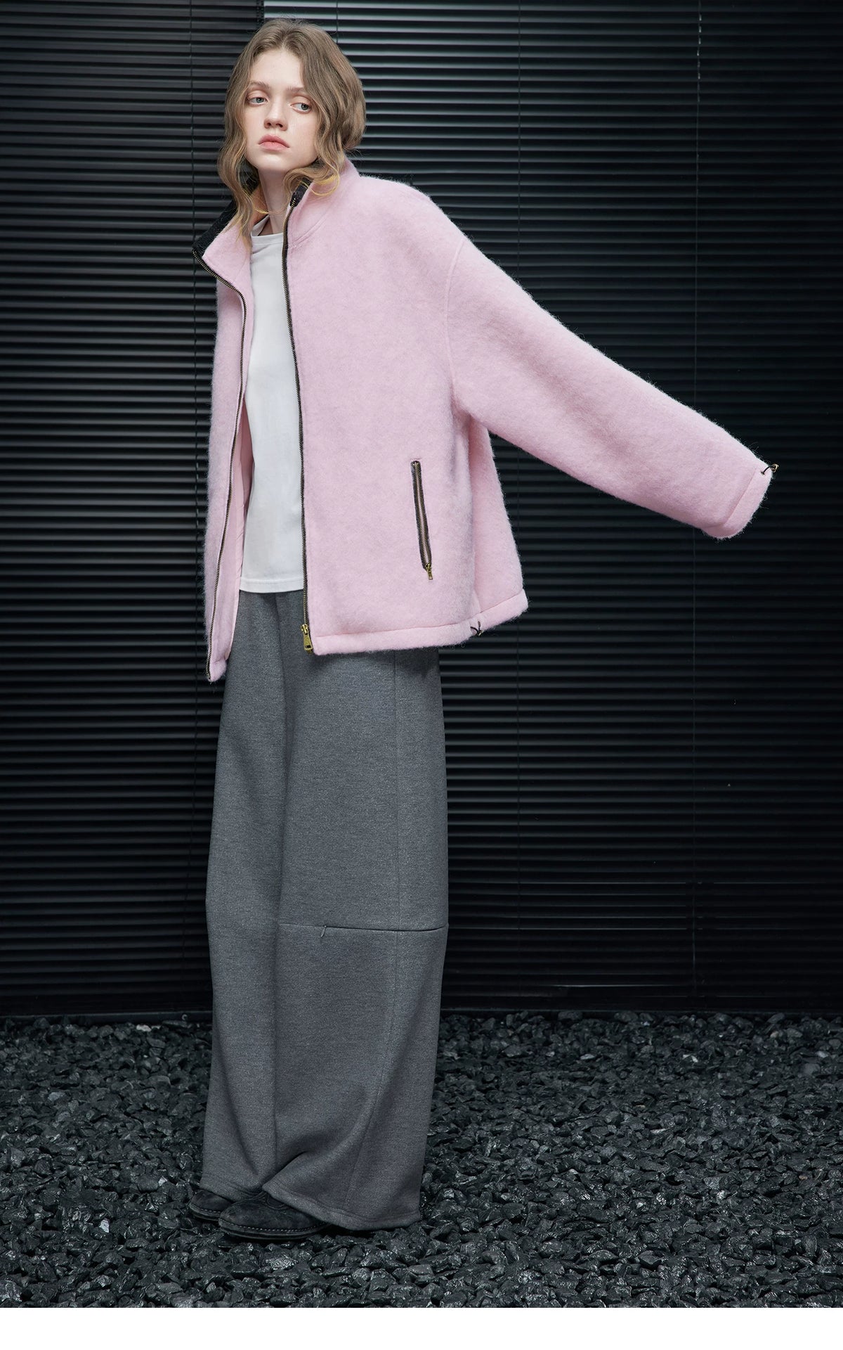 Full-length side view of a Pink cropped wool-blend zip jacket with dropped shoulders and hem toggle
