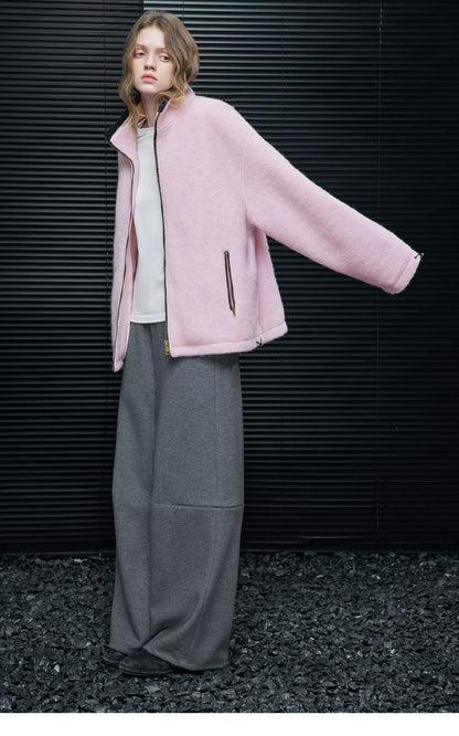 Full-length side view of a Pink cropped wool-blend zip jacket with dropped shoulders and hem toggle