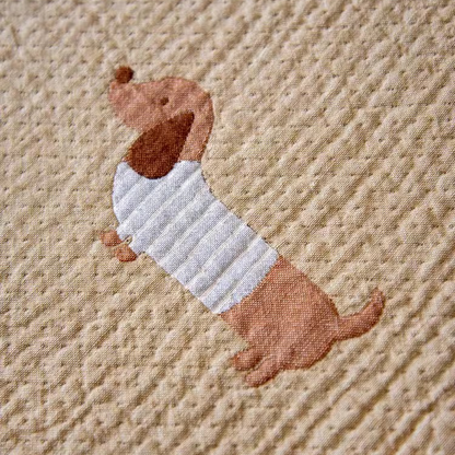 Detailed cotton gauze texture view of Playful Pals Cotton Gauze Quilted Blanket Puppy highlighting soft quilted weave