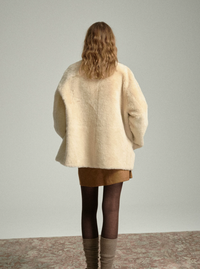 Back view of boxy oat merino shearling jacket with dropped shoulders