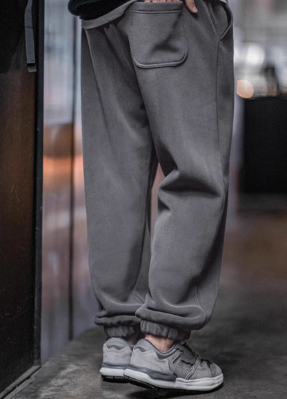 Back view of Plush Relax Joggers in Lead Gray showing patch pocket design and elastic waistband detail