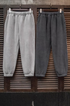 Plush Relax Joggers in Tin Gray and Lead Gray front view showing relaxed fit fleece sweatpants with elastic cuffs and waistband