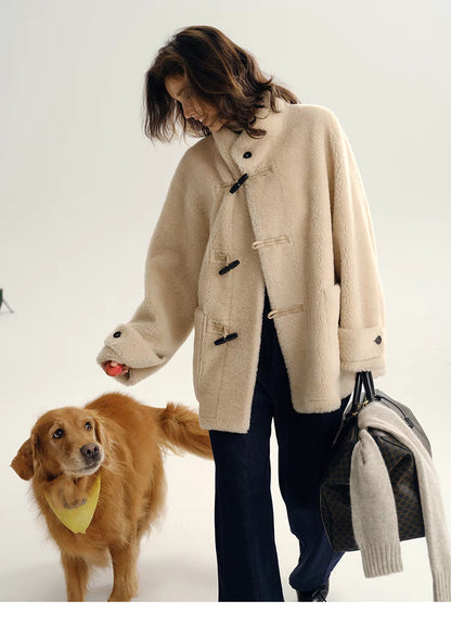 Full-body look of Plush Toggle Coat in warm apricot styled casually with dog, showing relaxed fit, mid-length silhouette, and soft wool texture