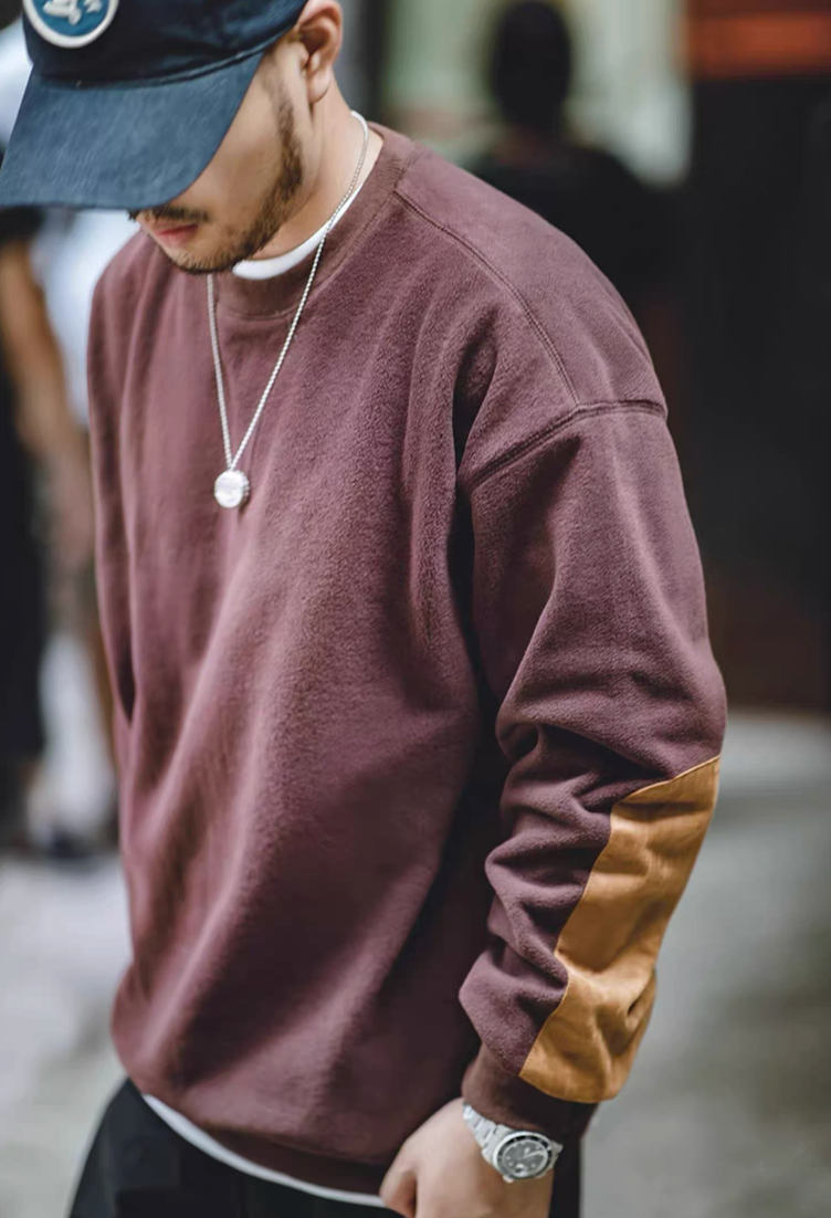 Side close-up of Wine Red Fleece Sweatshirt with suede elbow patch