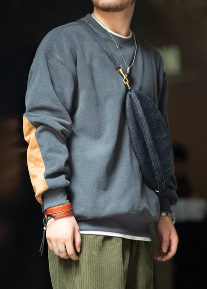 Side view of Slate Blue Fleece Crewneck with suede elbow patch