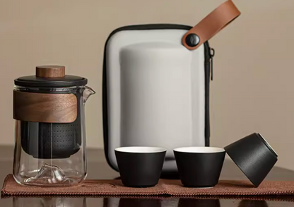 Black portable outdoor travel tea set with glass teapot ceramic cups and carrying case