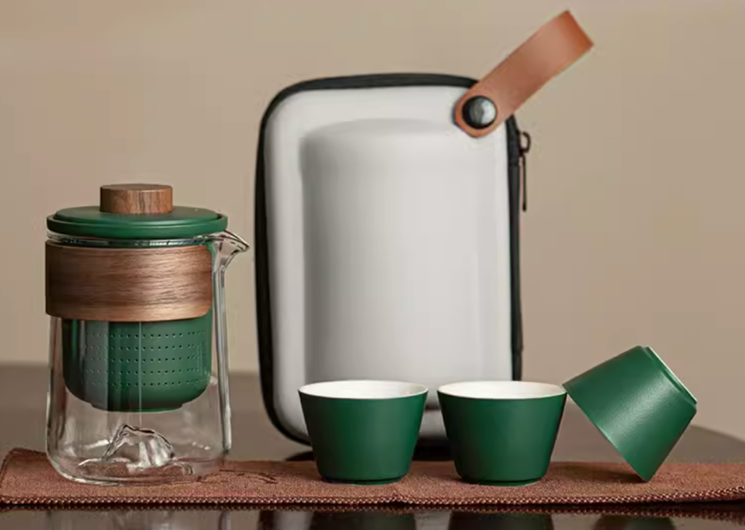 Dark green portable outdoor travel tea set with glass teapot cups and carrying case