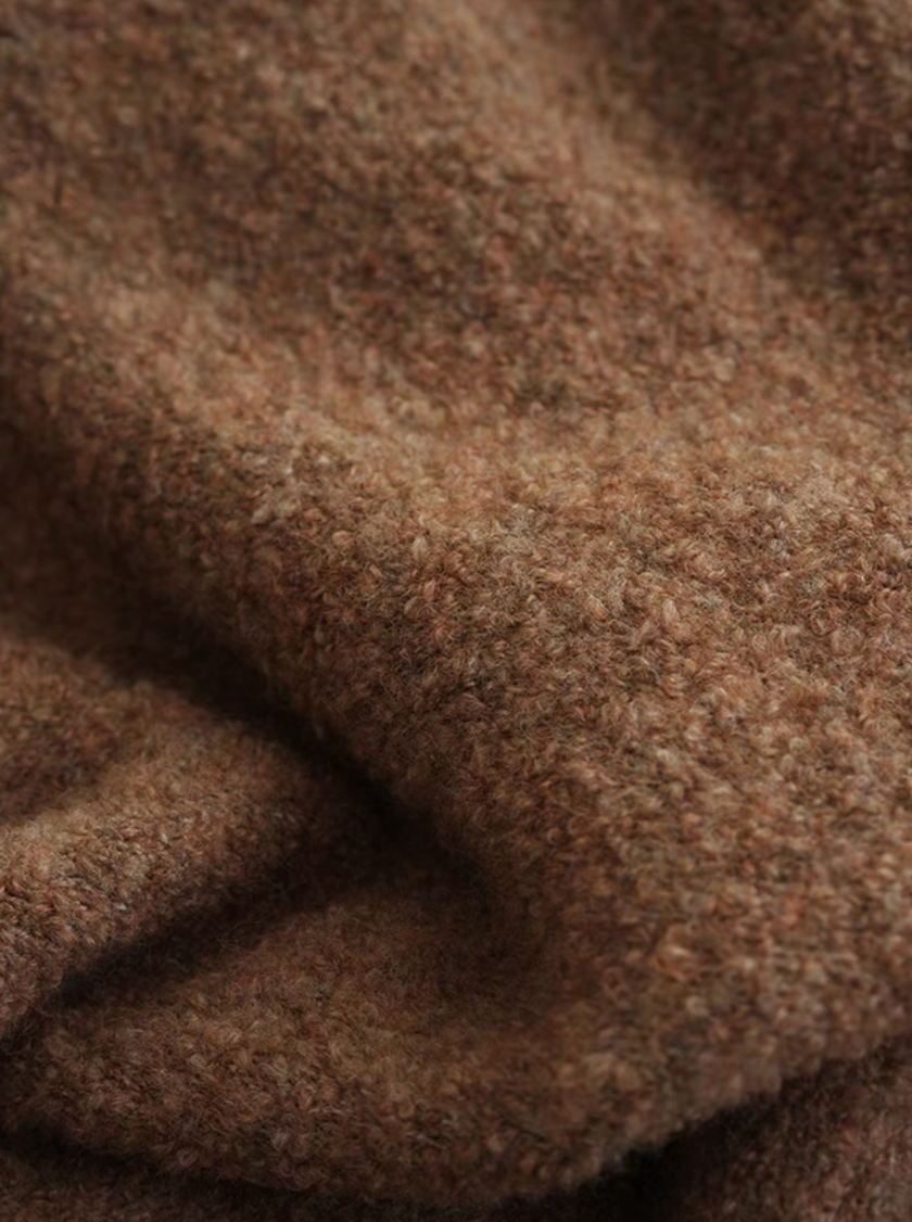 Close-up of mocha brown pure wool throw blanket showing dense soft texture and rich warm tone