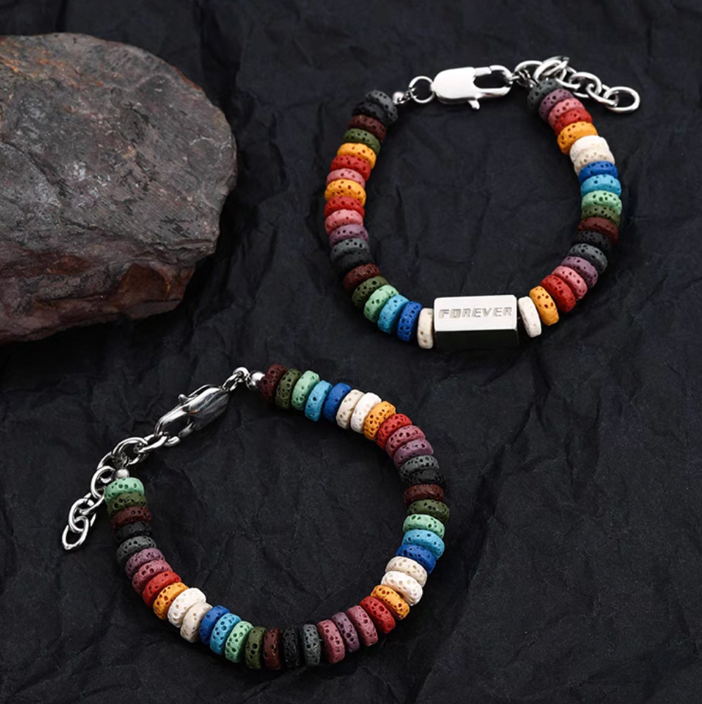 Two rainbow lava stone bracelets showing plain and square bead styles with vibrant multicolor beads on dark background